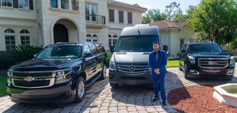 Jacksonville car service chauffeur at Ponte Vedra or Amelia Mansion with black car and sprinter