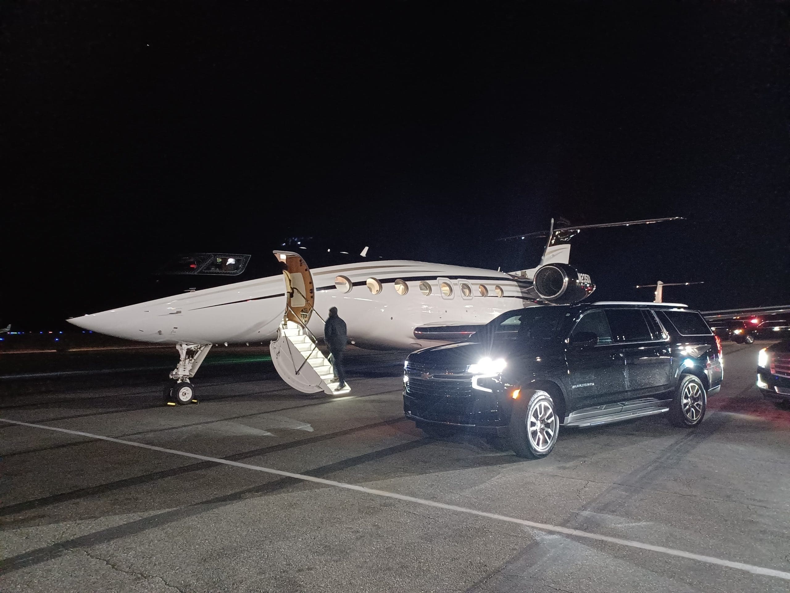 Jacksonville Airport Black Car Service FBO Chauffeur Jacksonville Airport Black Car Service - night FBO Chauffeur on runway