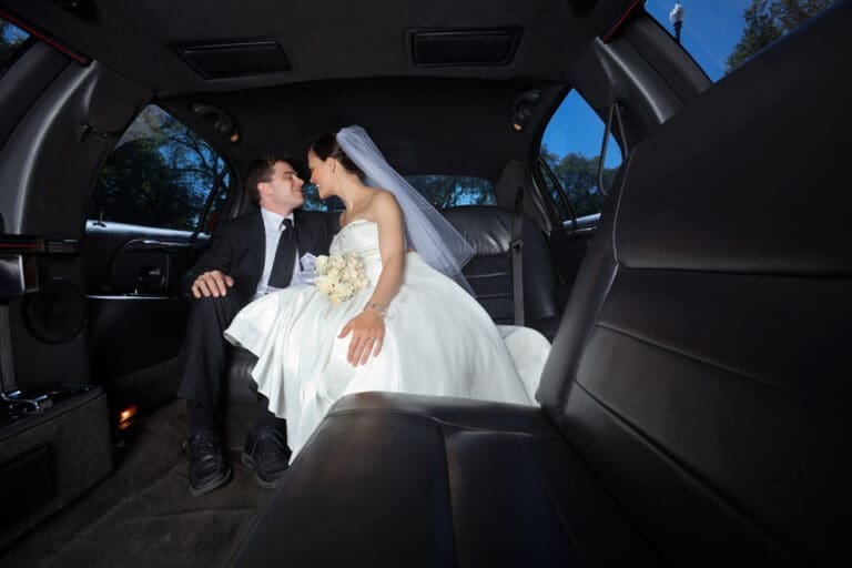 Wedding bride - groom in car service limo